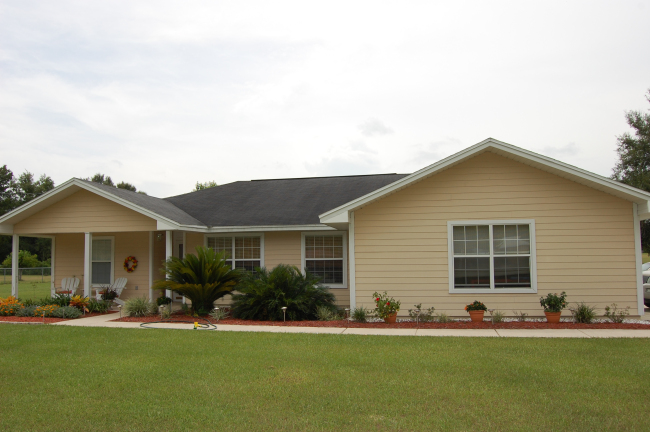 Turn Key - one owner home, smoke free. Three bedroom, two bath home with pool added in 1998, pool liner replaced in 2008. 240 sq. ft. Florida room added in 2000 overlooking pool area. Tile in home updated in 2006, carpet replaced in 2007. Home also features new dishwasher & guest bathroom redone in 2008 replacing tub with all tile shower, updated lighting, master bedroom has walk in closet & laundry room located between garage, kitchen & master bedroom. New front porch tile in 2009. Home also has a fireplace in the living room with an open floor plan and split bedroom. Lovely landscaping makes for a great drive by. Home a true pleasure to show. 