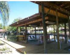 J R's Paradise (see the newly carved painted sculpture on the tree in the front yard) on a deep wide canal of The St. Johns River.  LOTS NEW since fall of 2011 - seawall, dock, boat motor cables, sheet rock, metal roof - double pane windows and more!  Water views from many rooms and screen porch - waterfall and fountain fed from the canal as well as irrigation system. Detached building with electric that makes a wonderful workshop. Hop in your boat from your covered slip and cruise down the canal(filled with fish and a manatee or two might even visit that you can watch from your covered dock patio) to The St. Johns River that leads to oh so many exciting adventures such as a cruise down Blue Creek with lots of nature to observe, a ride north through Lake George to Silver Glen and Salt Spring Run for a swim in the clear waters, or head south to Lake Dexter for some great fishing.  This small community of Astor has much to do off the water too - calendar of events can be seen on The Astor Area Chamber website and you are not far from the beaches, DeLand and area attractions.  So come look and learn more about this area surrounded by The Ocala National Forest - make it your retreat or permanent home - WHAT A LIFE STYLE - Make it yours today - available for quick occupancy!!  Not a Short Sale or Bank owned/REO or Foreclosure so fairly quick response time from the cooperative sellers wanting a buyer who will appreciate and enjoy the property as they have.